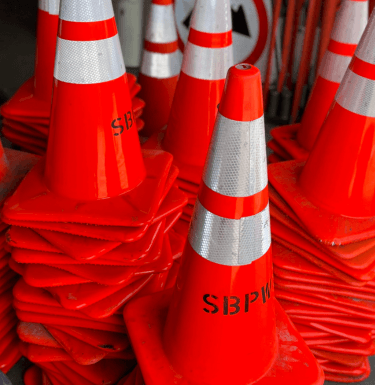 Image of a stack of traffic cones with the marking SBPW